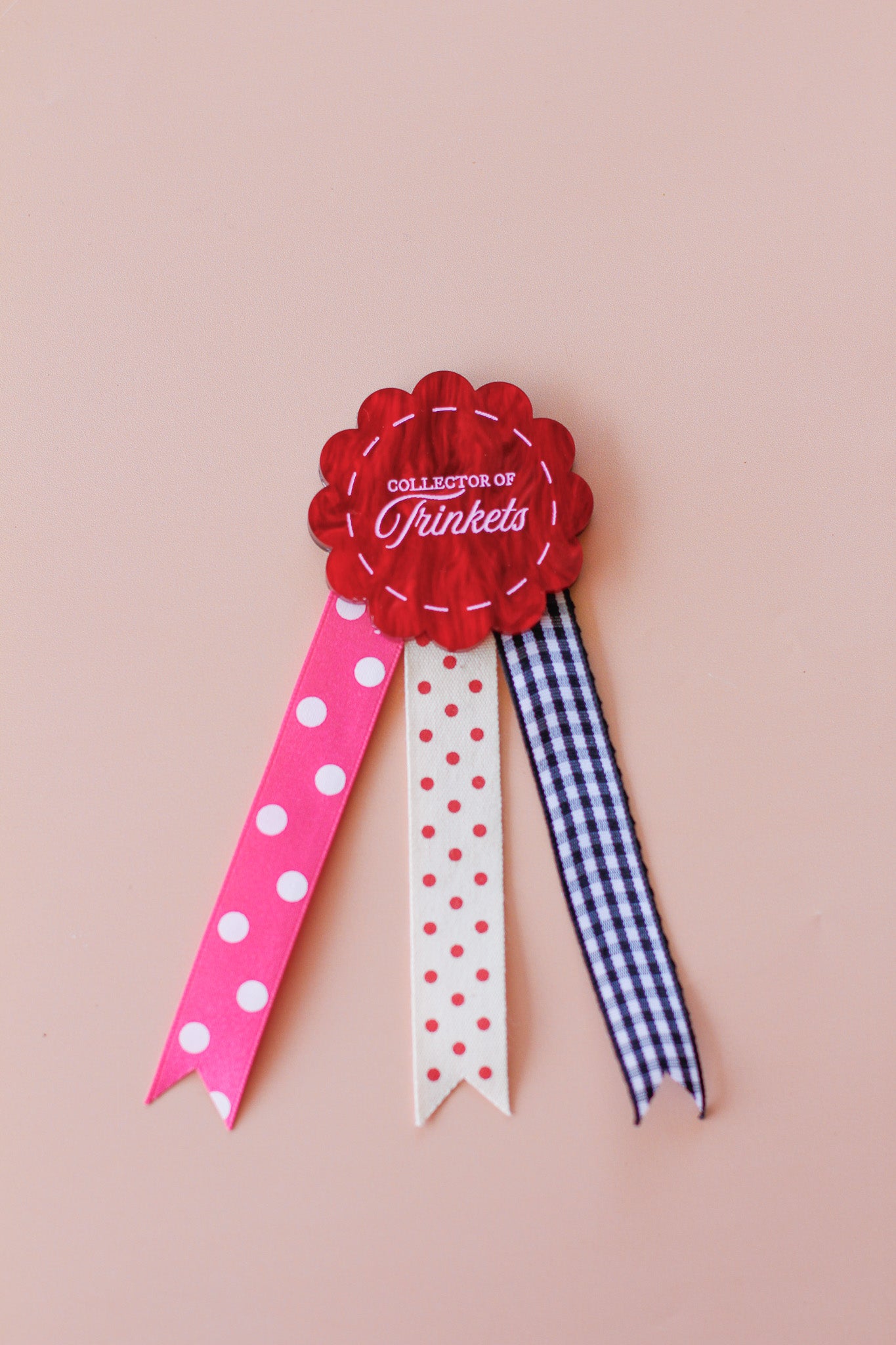 collector of trinkets rosette badge