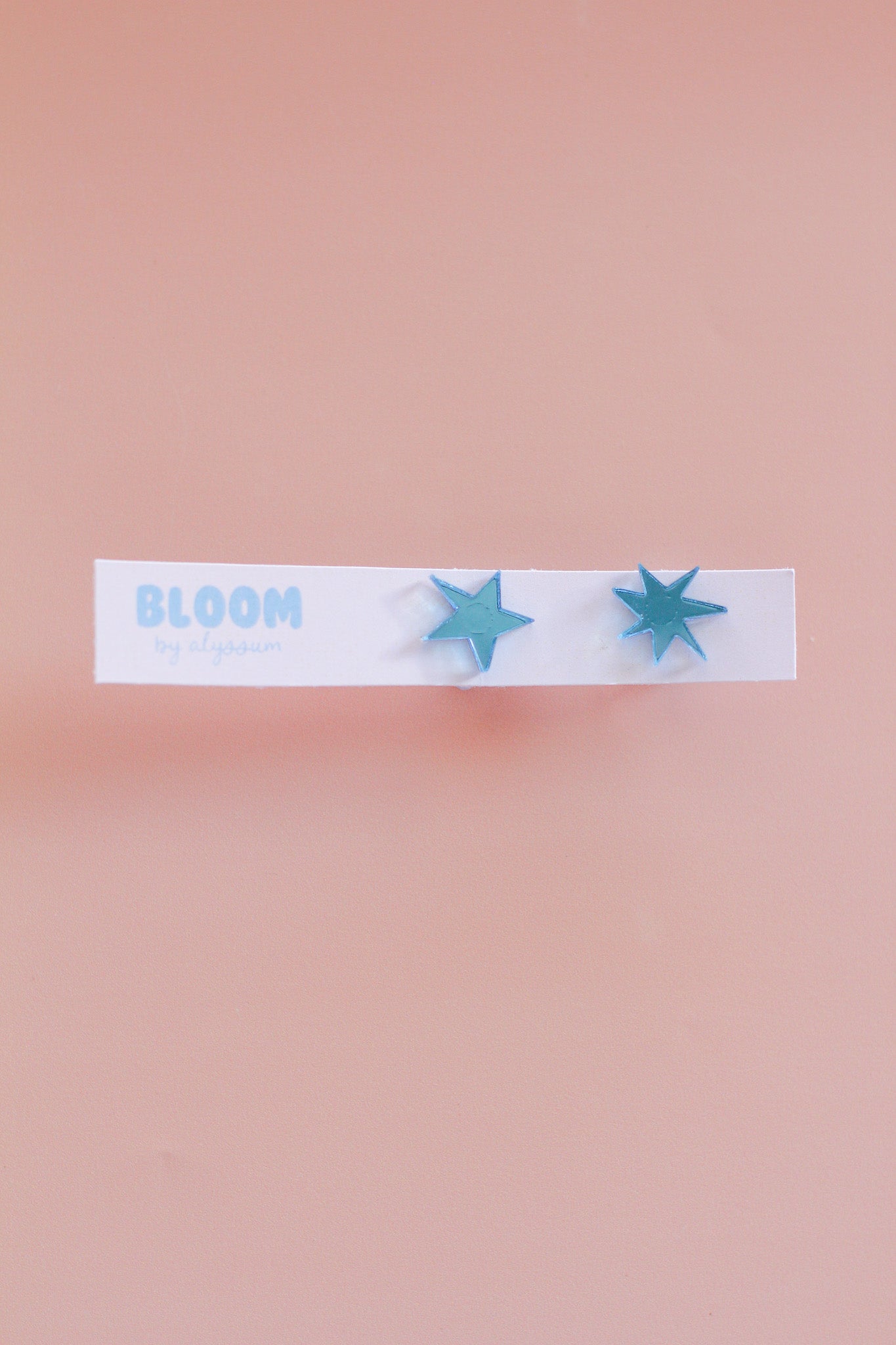 ember - mismatched star studs