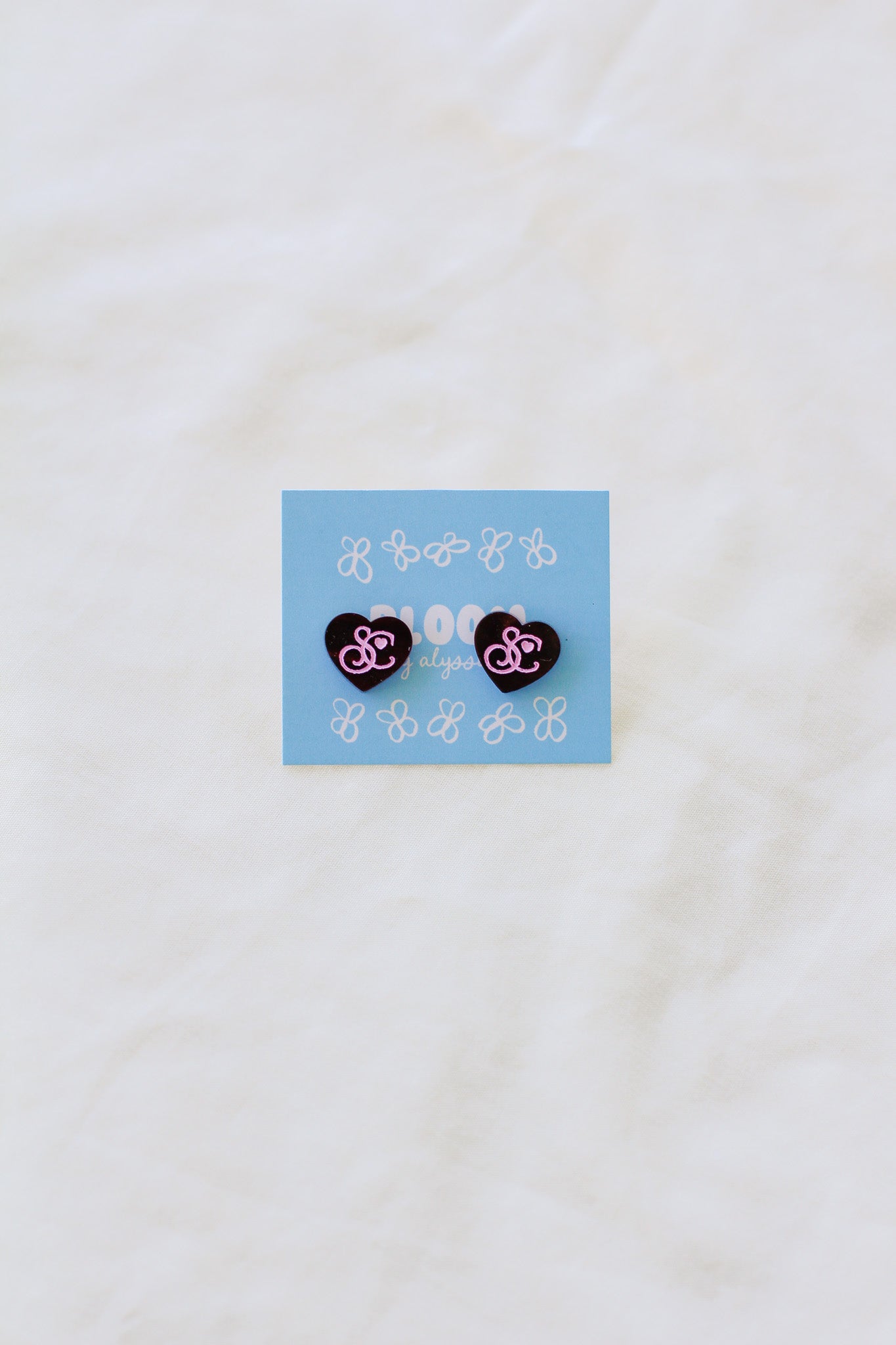 sabrina carpenter logo studs