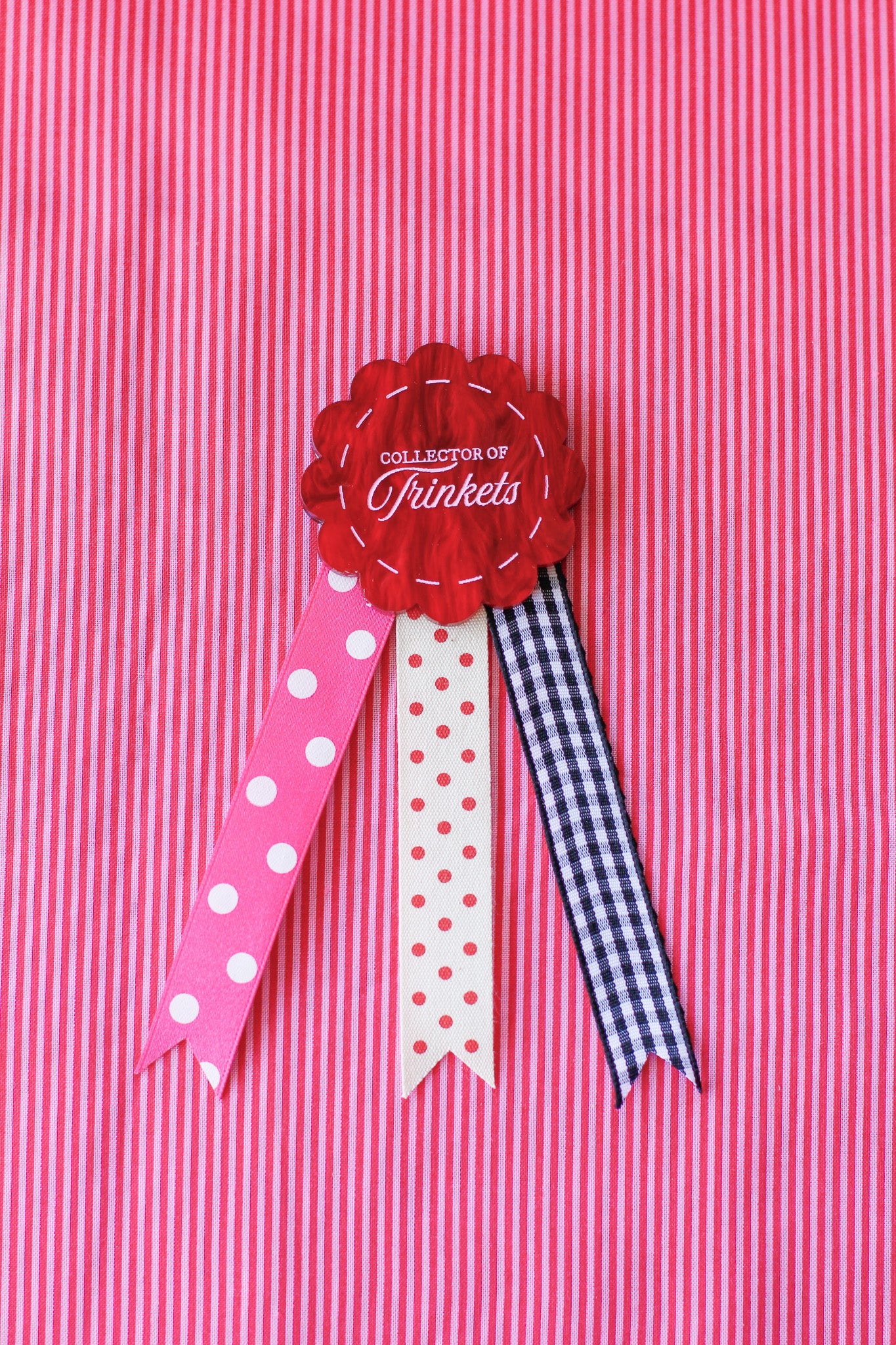 collector of trinkets rosette badge