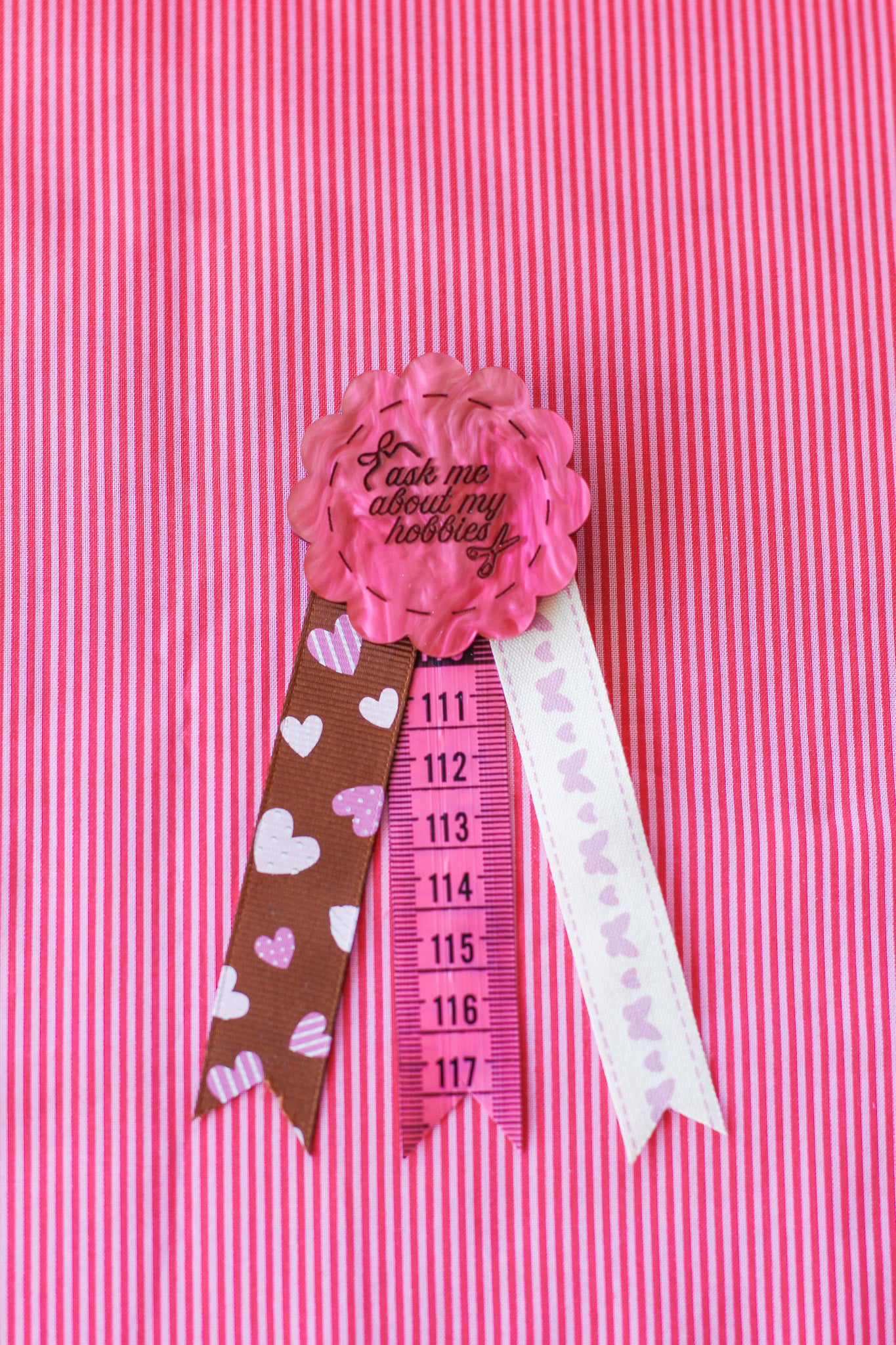 ask me about my hobbies rosette badge