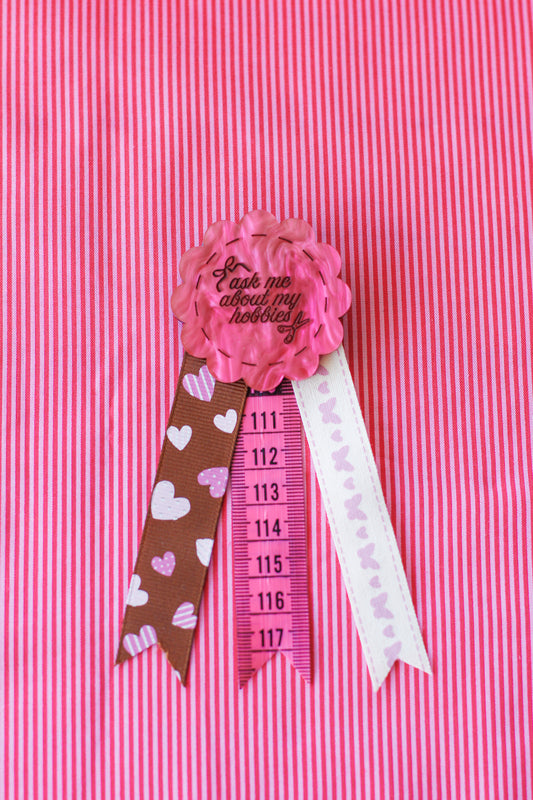 ask me about my hobbies rosette badge