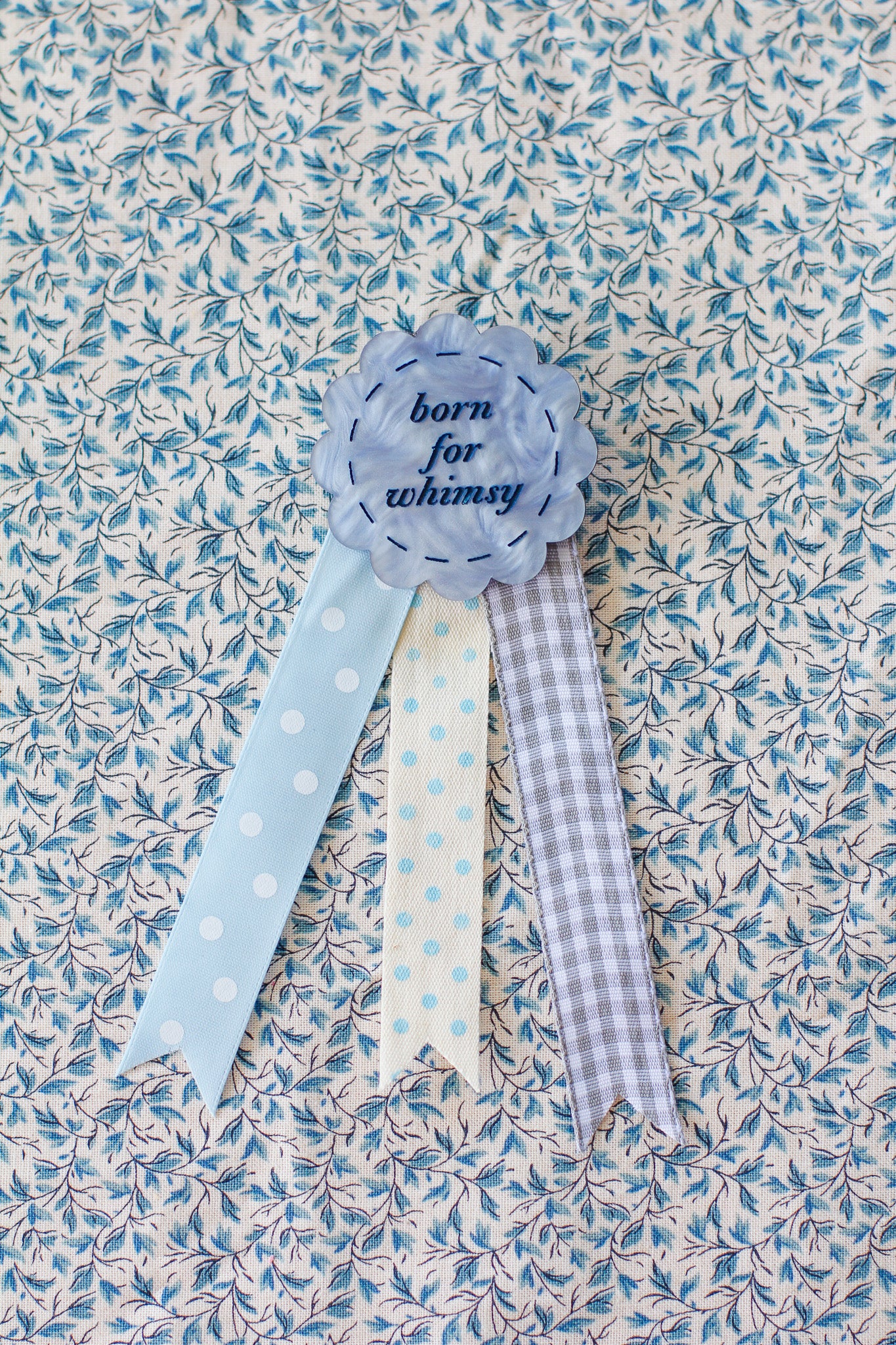 born for whimsy rosette badge